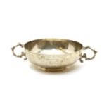 A silver planished twin handled bowl,