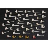A collection of various clay pipes,