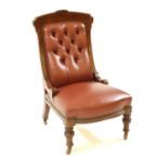 A walnut frame red leather button backed library chair,