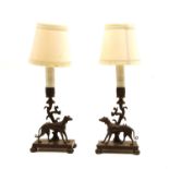 A pair of cast bronze candlestick lamps,