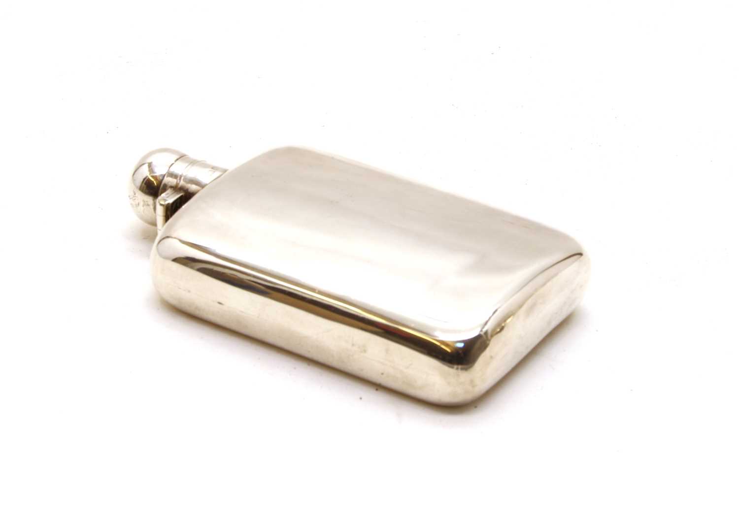 A silver hip flask,