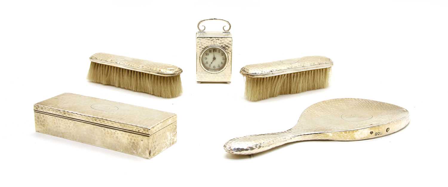 A hammered silver dressing table set,