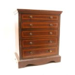 A late 19th Century inlaid mahogany 'apprentice piece' miniature chest of drawers,