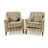A pair of modern upholstered tub armchairs,