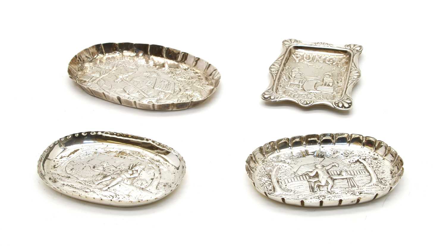 A Victorian silver pin dish with embossed landscape scene,