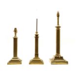 Three brass table lamps,