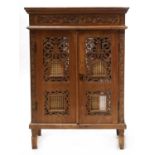 An Eastern hardwood two door cupboard,