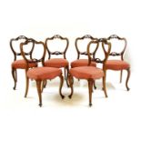 A set of six Victorian walnut chairs,