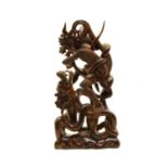 A Far Eastern carved hardwood group,