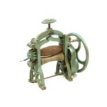 A 19th century cobblers rolling machine for leather,