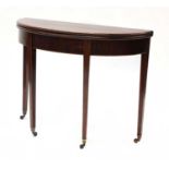 A George III strung mahogany demi-lune card table,