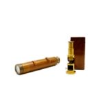 A brass cased microscope,