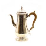 A modern George III style silver coffee pot,