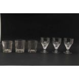 A set of seven cut glass claret glasses