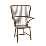 An American beechwood framed comb back armchair, circa 1900