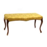 A Victorian walnut stool,