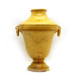 A studio pottery honey glazed terracotta wall vase