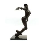 A modern bronze figure of a topless female roller skater,