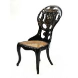 A Victorian papier mache low chair,