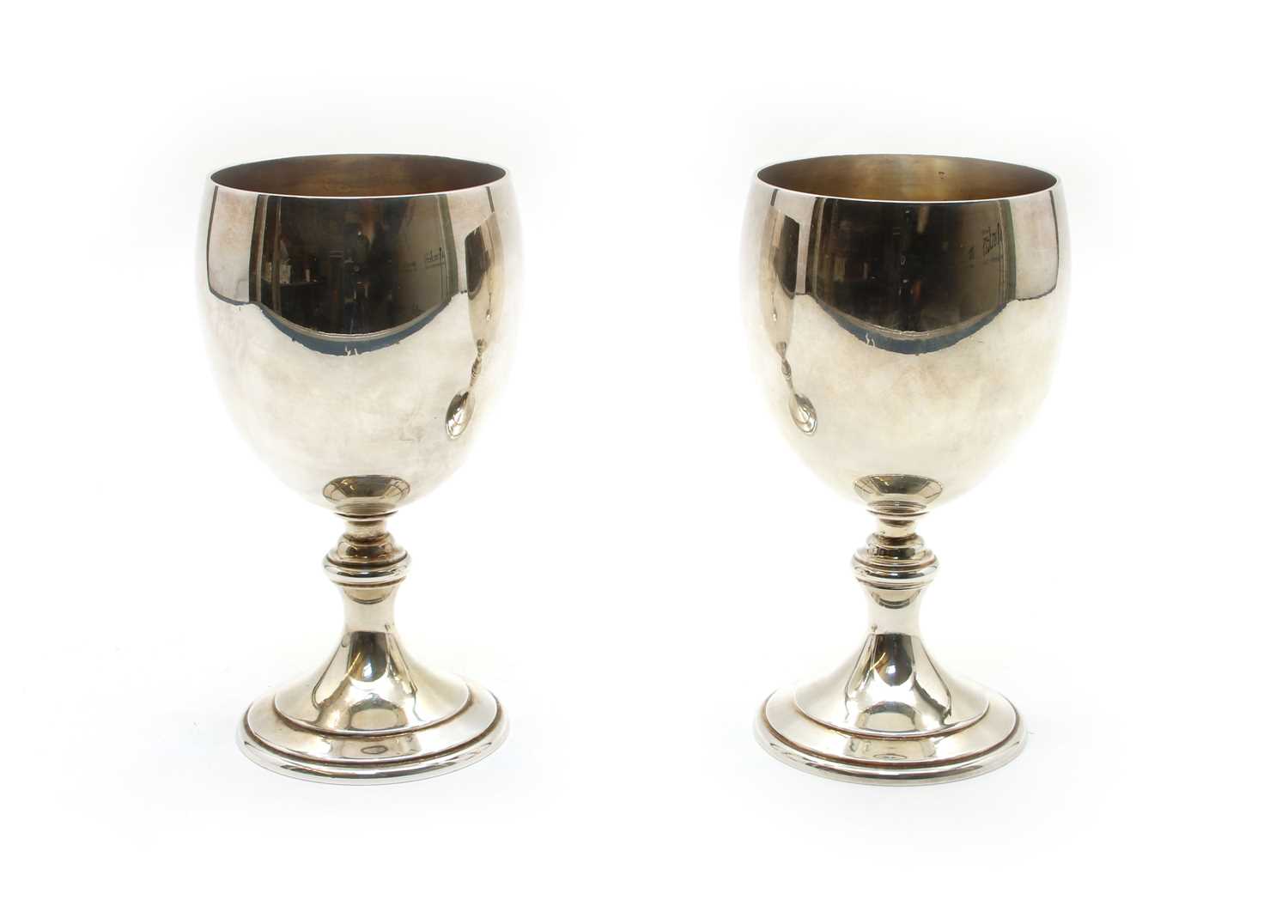 A pair of silver goblets,