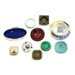 A large collection of ashtrays,