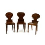 Three similar Victorian mahogany hall chairs,