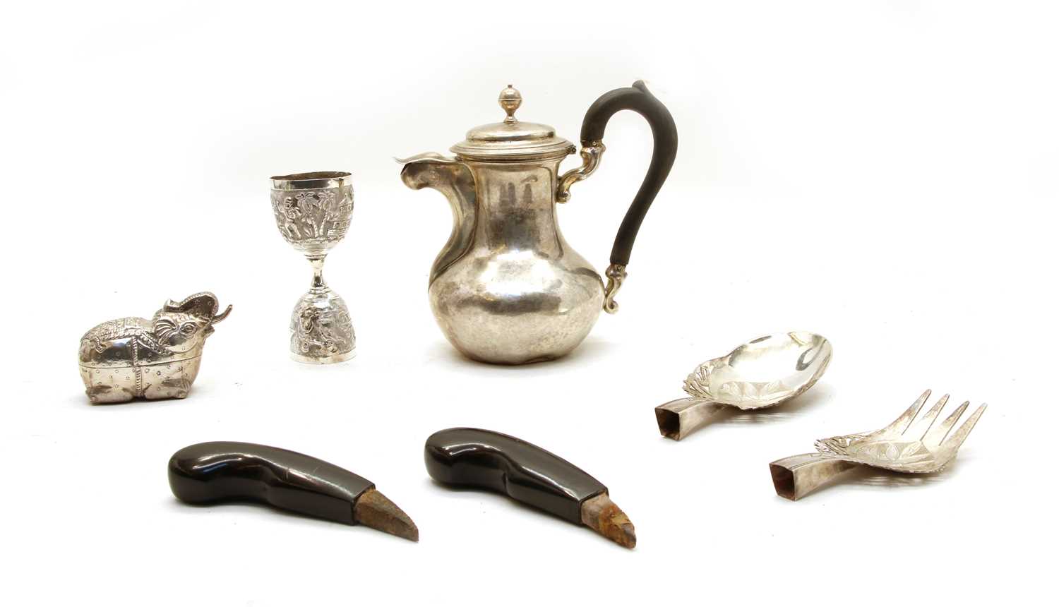 A collection of white metal items