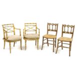 A pair of Regency style faux bamboo elbow chairs,