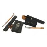 Two Japanese smoking sets, kiseruzutsu (pipecase) with kiseru and tabako-ire (tobacco pouch),