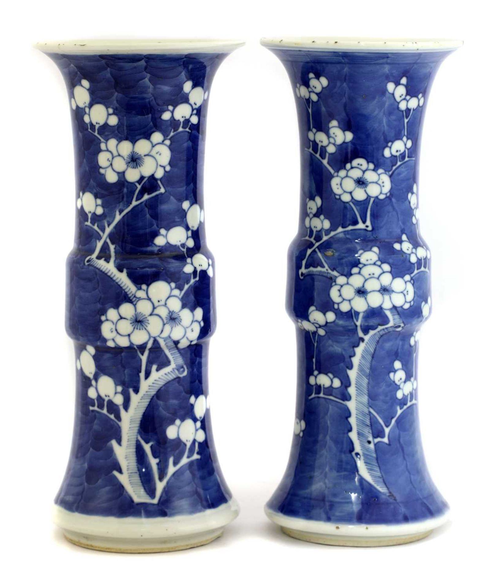 A pair of Chinese blue and white gu vases,