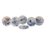 A collection of ten blue and white saucers,