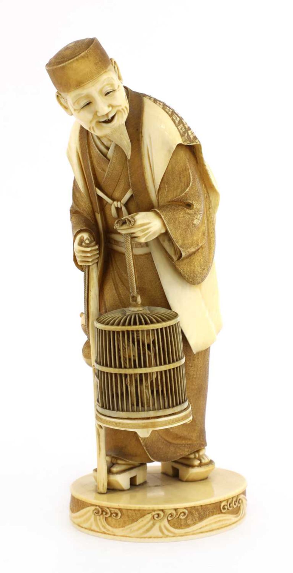 A Japanese stained ivory okimono,