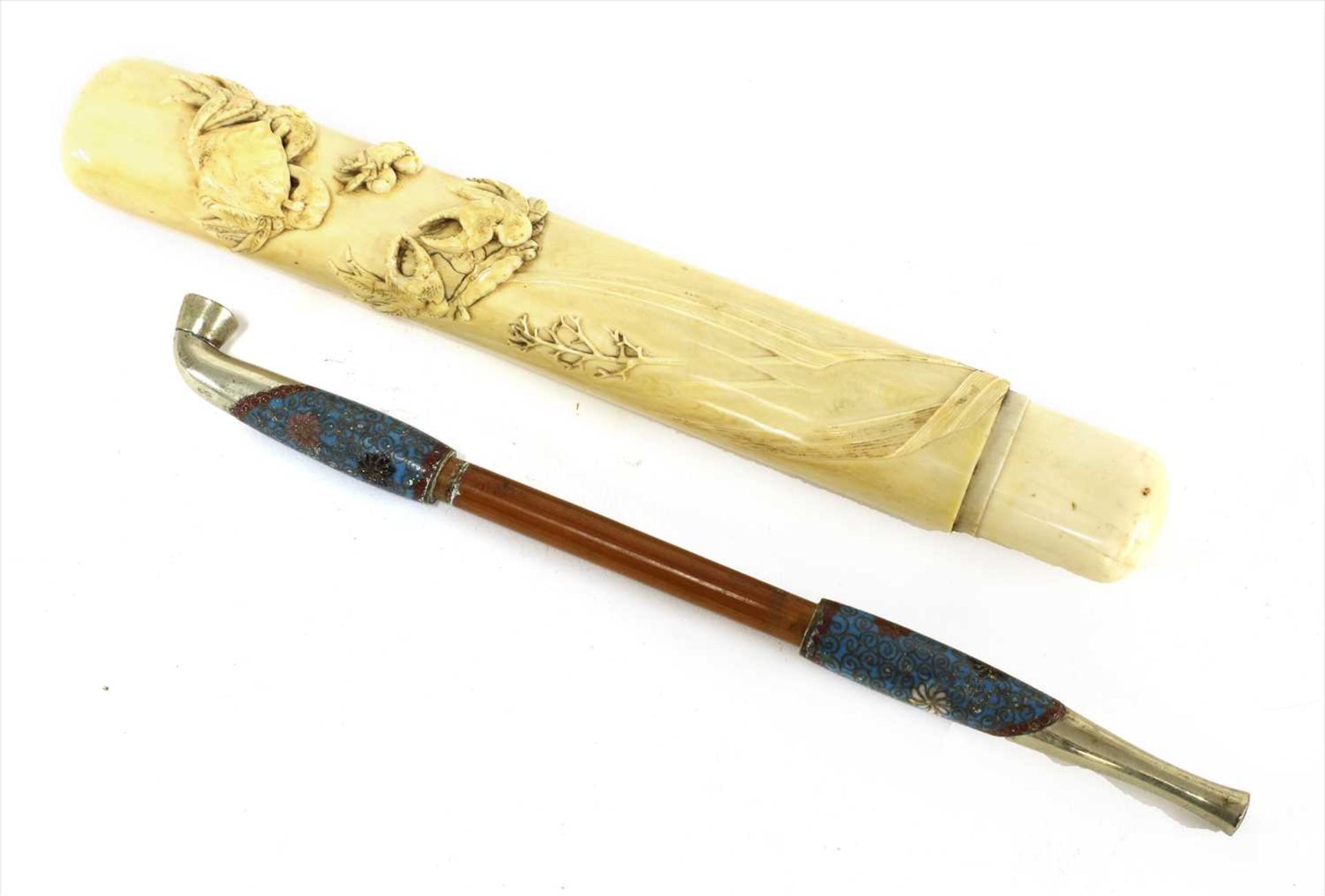 A Japanese ivory kiseruzutsu with kiseru,