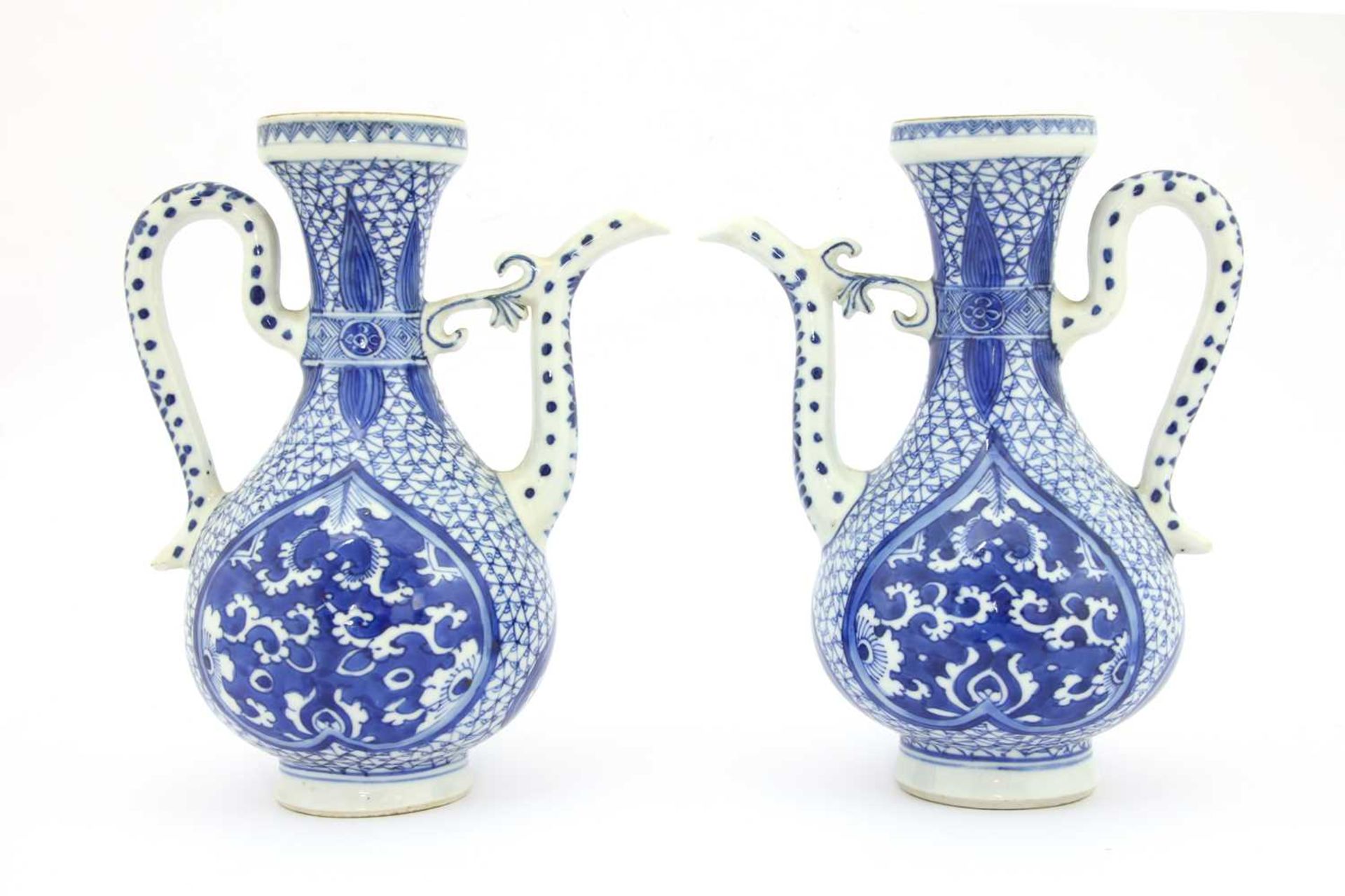 A pair of Chinese blue and white ewers,