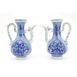 A pair of Chinese blue and white ewers,