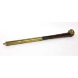 A Chinese wood and brass-mounted opium pipe,