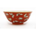 A Chinese coral-ground famille rose bowl,