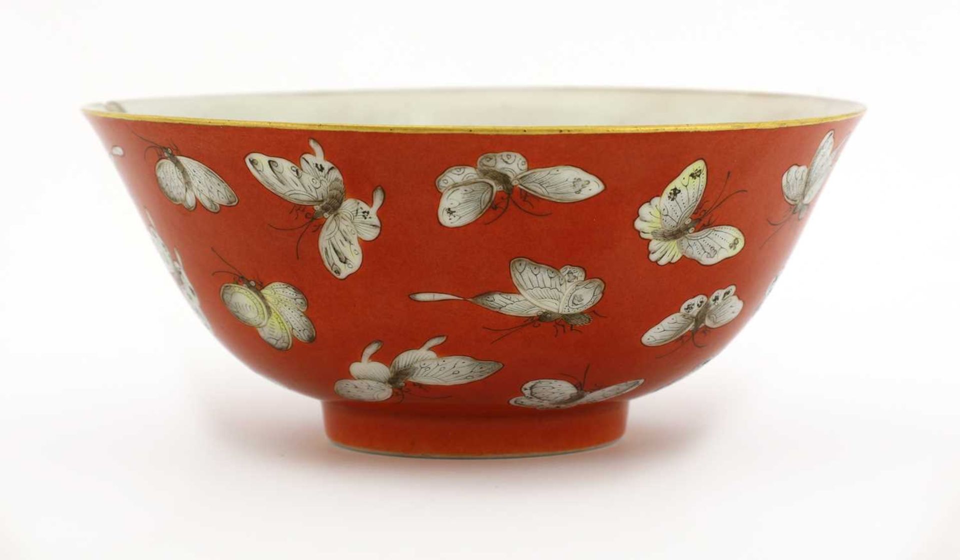 A Chinese coral-ground famille rose bowl,