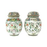 A pair of famille verte jars and covers,