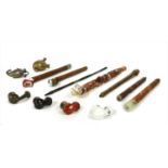 Four Persian carved wood pipes,
