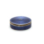 A 1920s French circular lidded blue guilloche enamelled box,