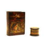 A Victorian novelty papiermache lacquer box in the form of a book,