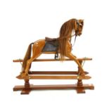 A large hardwood rocking horse by Stevenson Brothers,