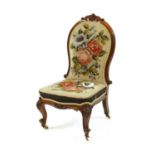 A Victorian rosewood nursing chair,