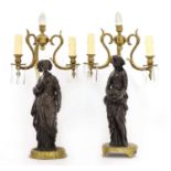 A near pair of gilt-bronze and spelter figural table lamps,