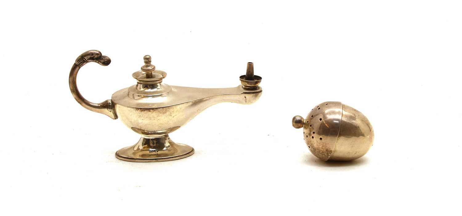 An Edwardian silver 'Aladdin' lamp cigar lighter by Asprey & Co., and a pomander (2)