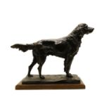 A bronzed resin figure of a retriever,