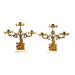 A pair of Continental gilt metal three light mantle candelabra,