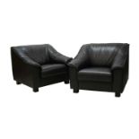 A pair of black leather armchairs,