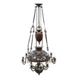 A Victorian twelve-light rise and fall pressed metal chandelier,